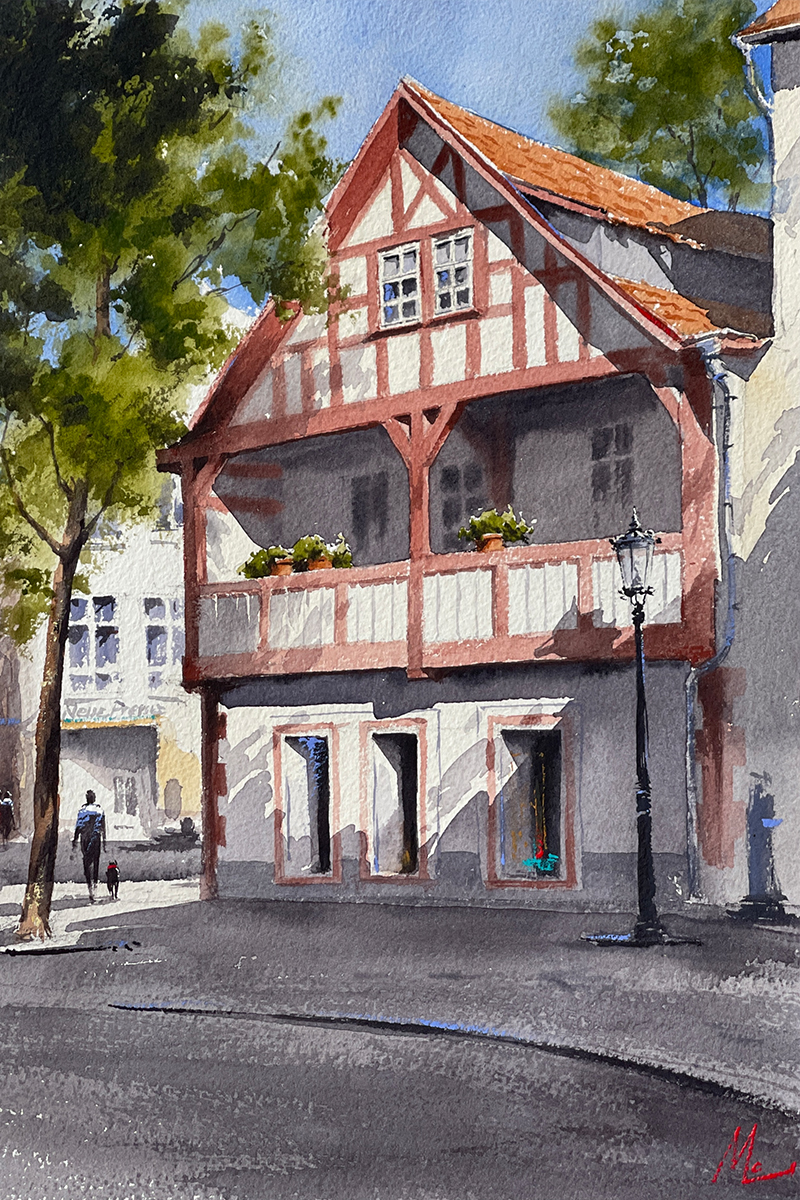 Aquarellgemälde eines rot und weißen Fachwerkshauses.